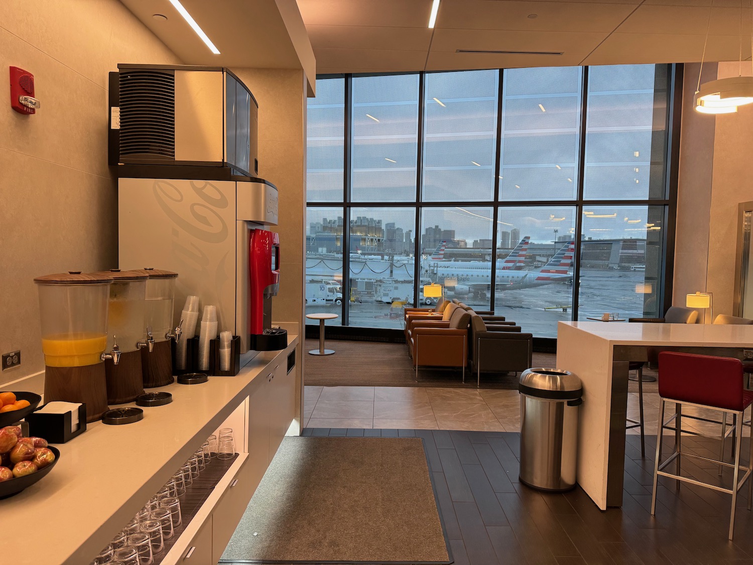 a room with a large window and a view of the airport