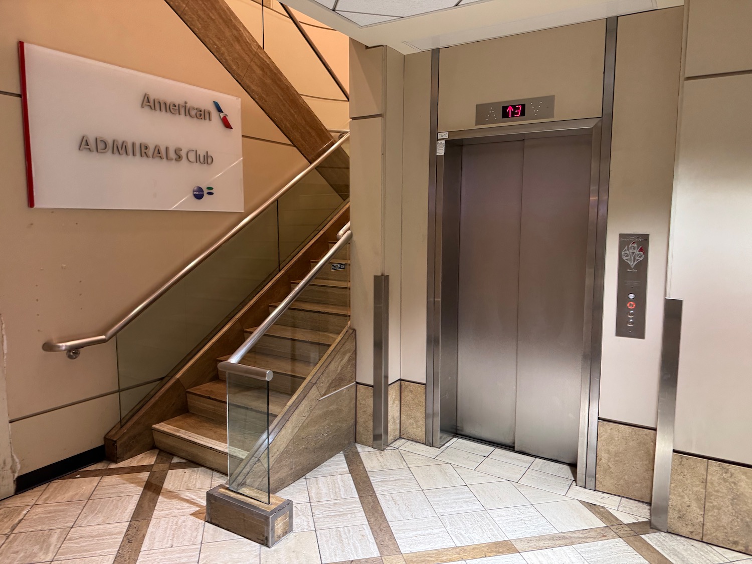 an elevator with a glass railing