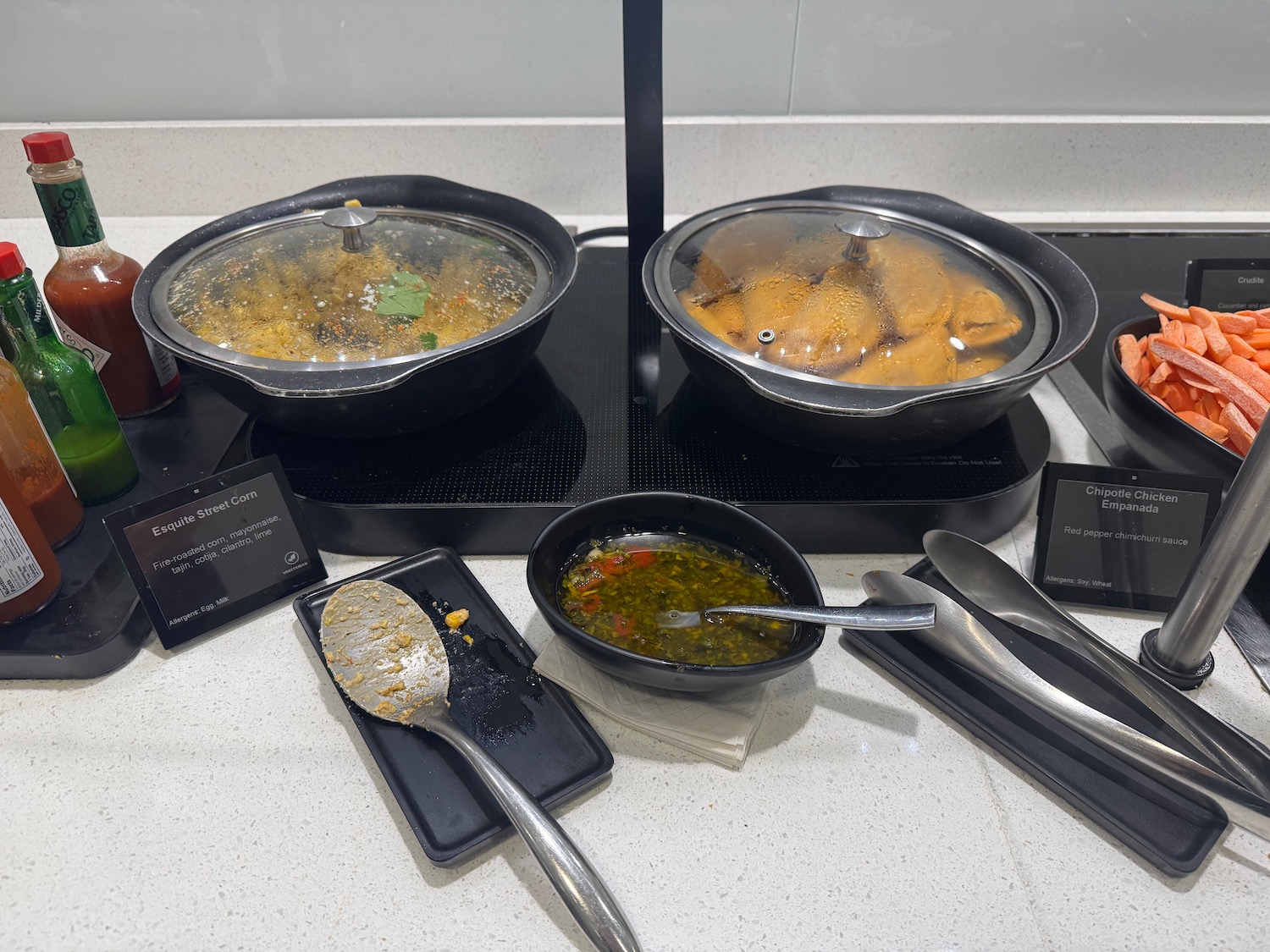 a group of bowls of food on a counter