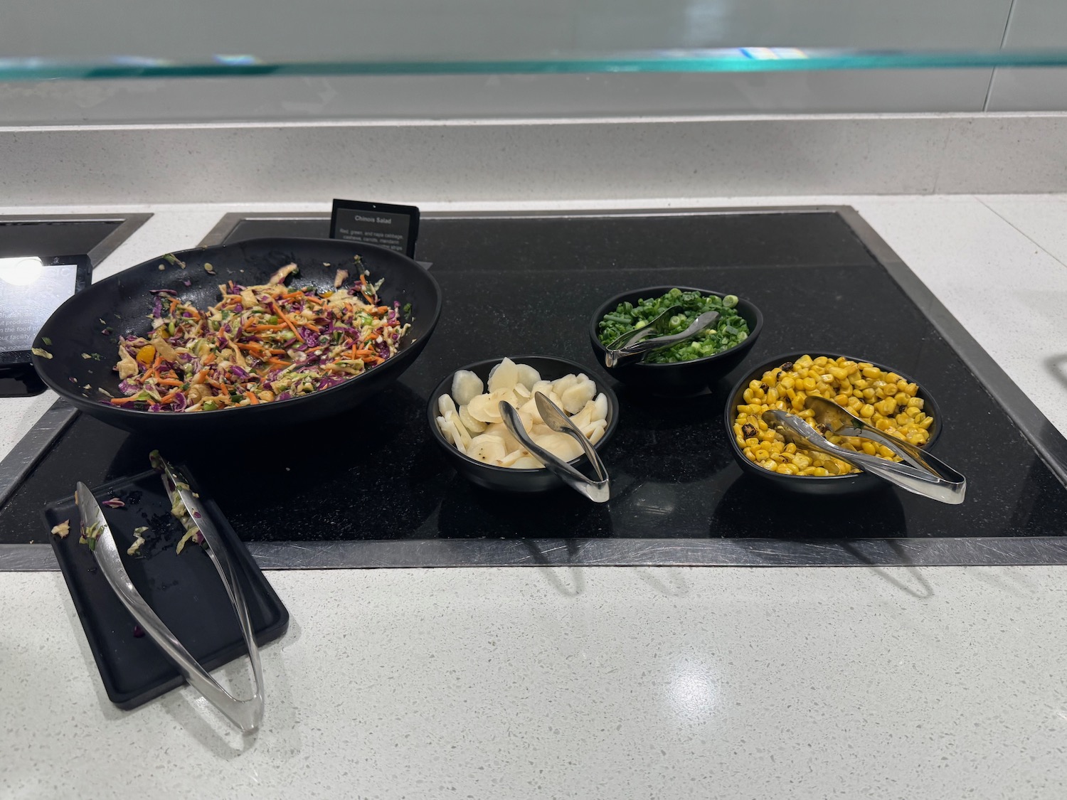 a group of bowls of food on a counter