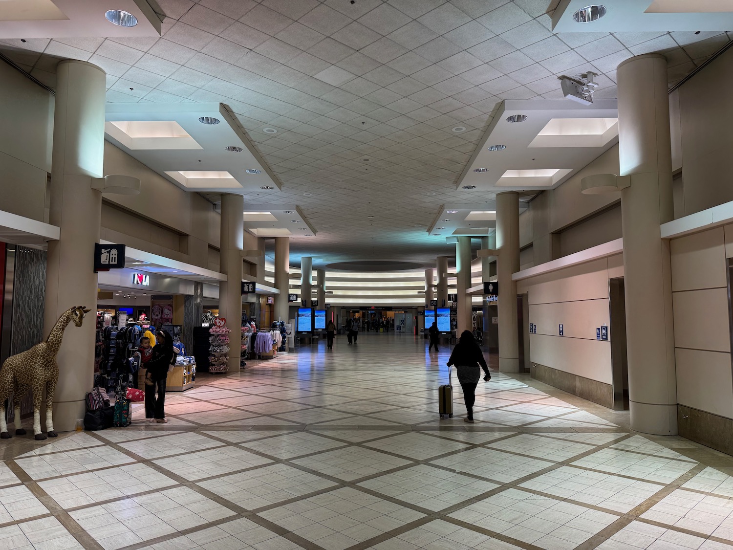 a person walking in a large hallway