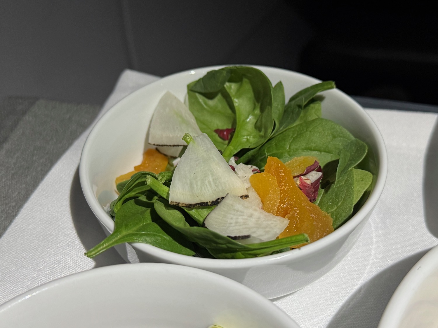 a bowl of salad with fruit