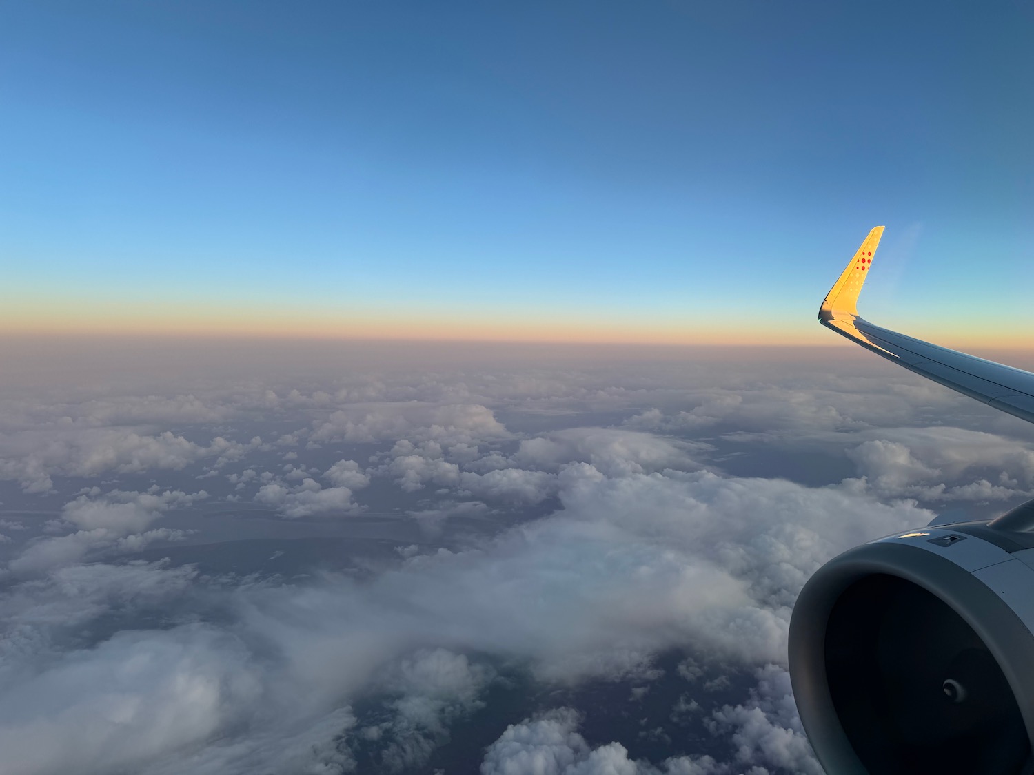 an airplane wing and the sky