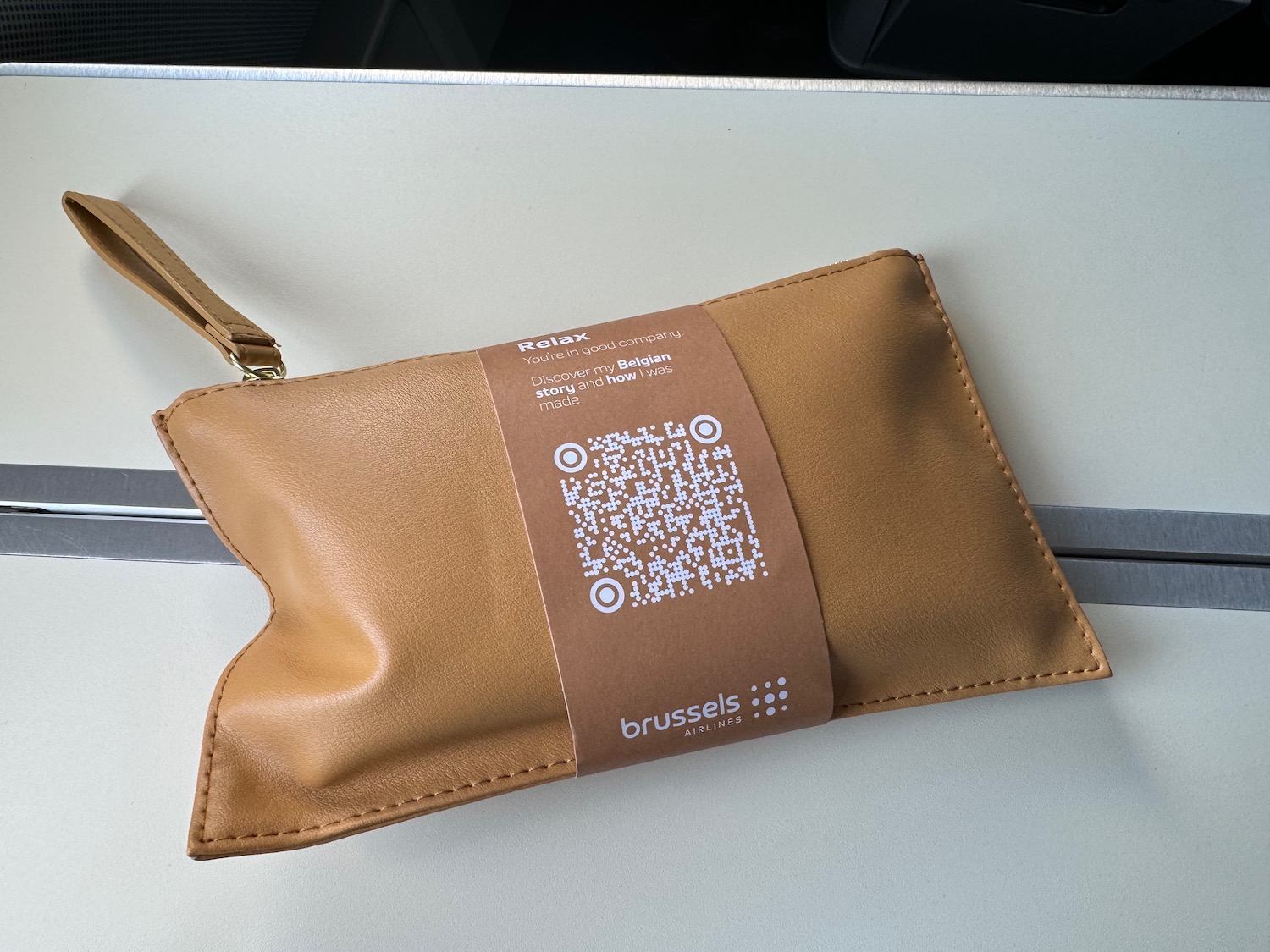 a brown pouch with a qr code on it