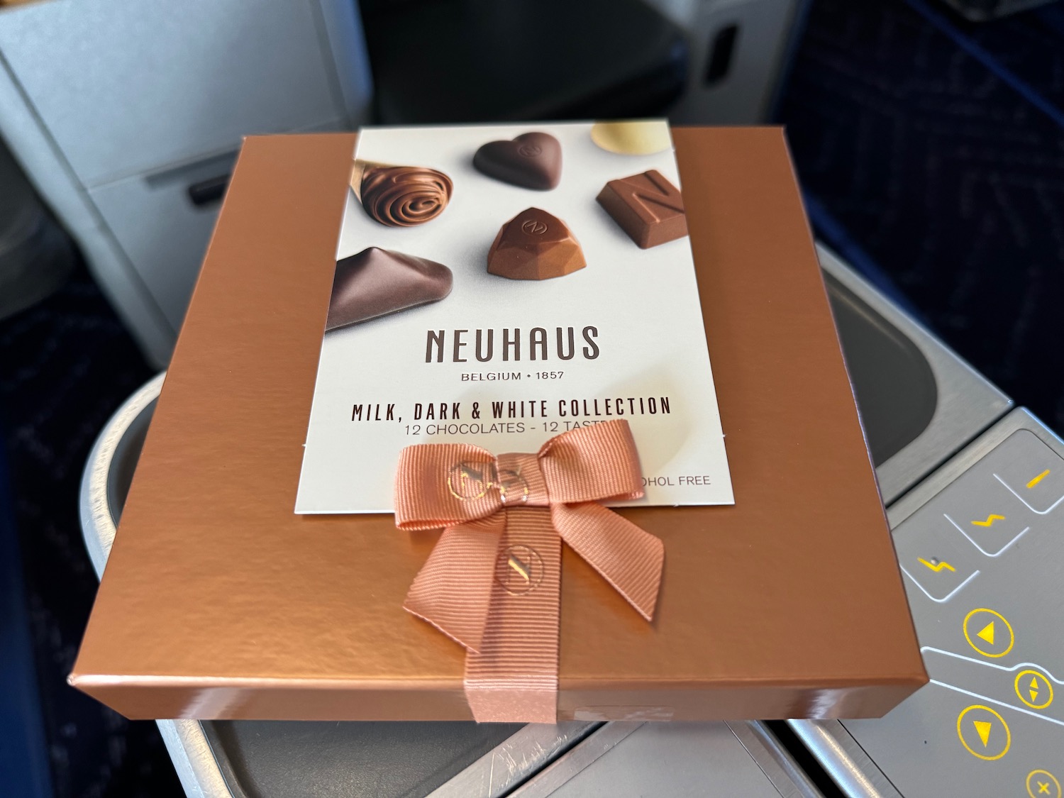 a box of chocolate on a plane