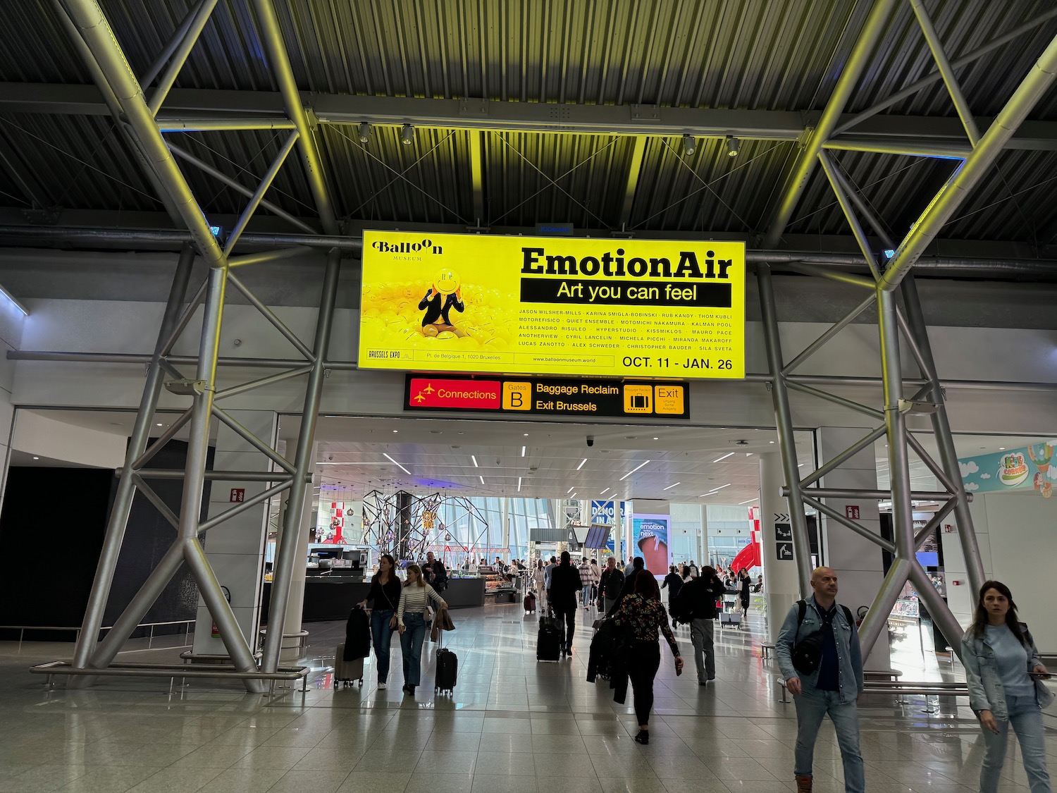 a group of people walking in an airport