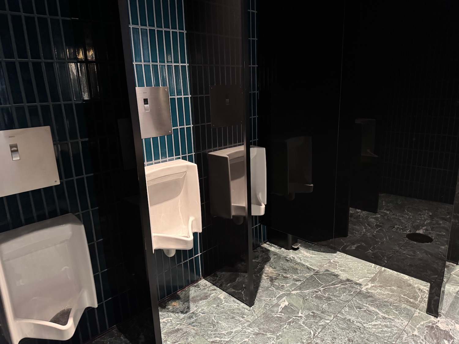 a urinals in a public bathroom