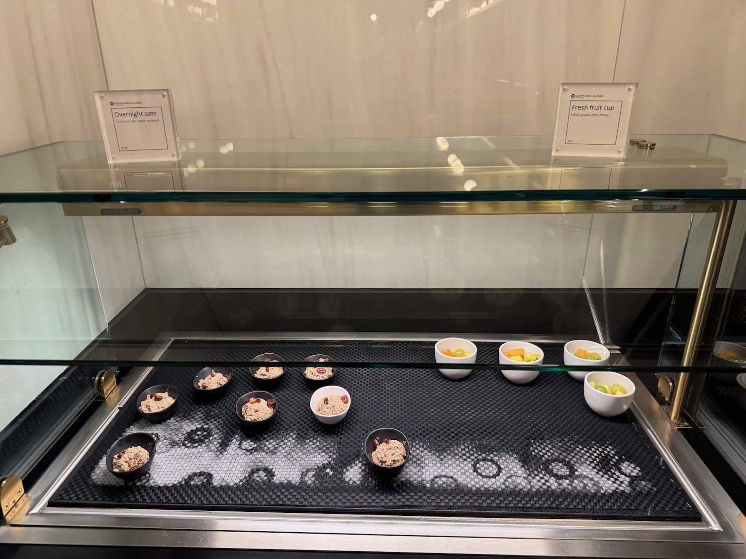 a display case with bowls of food