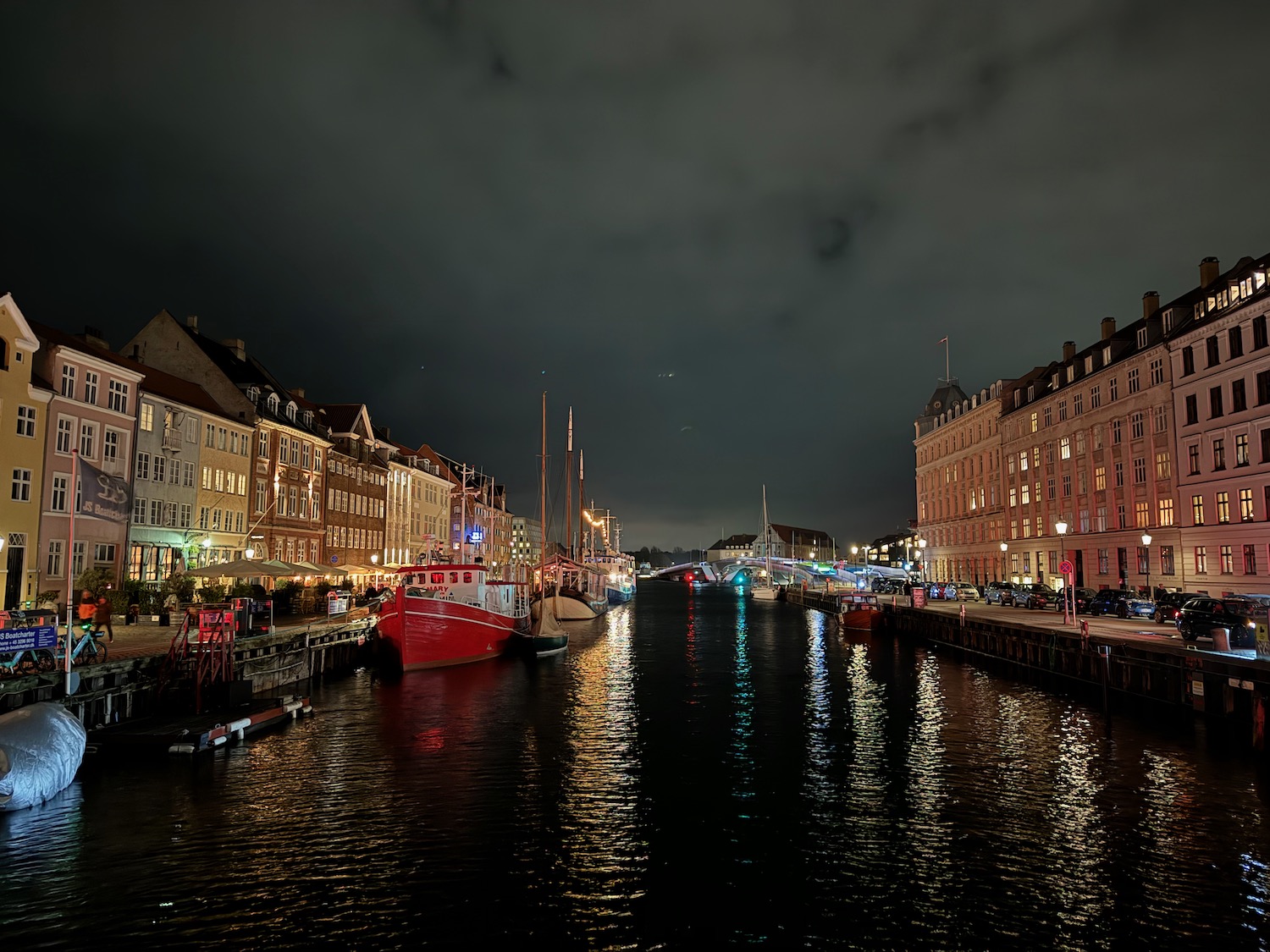 a water way with boats and buildings in the background