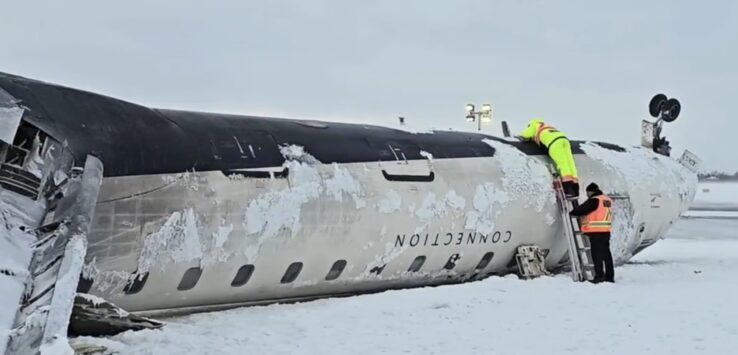 a group of people climbing on a plane