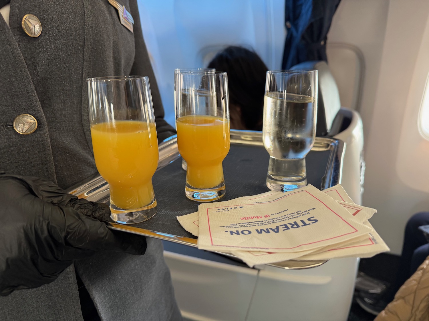 a tray of drinks on a plane