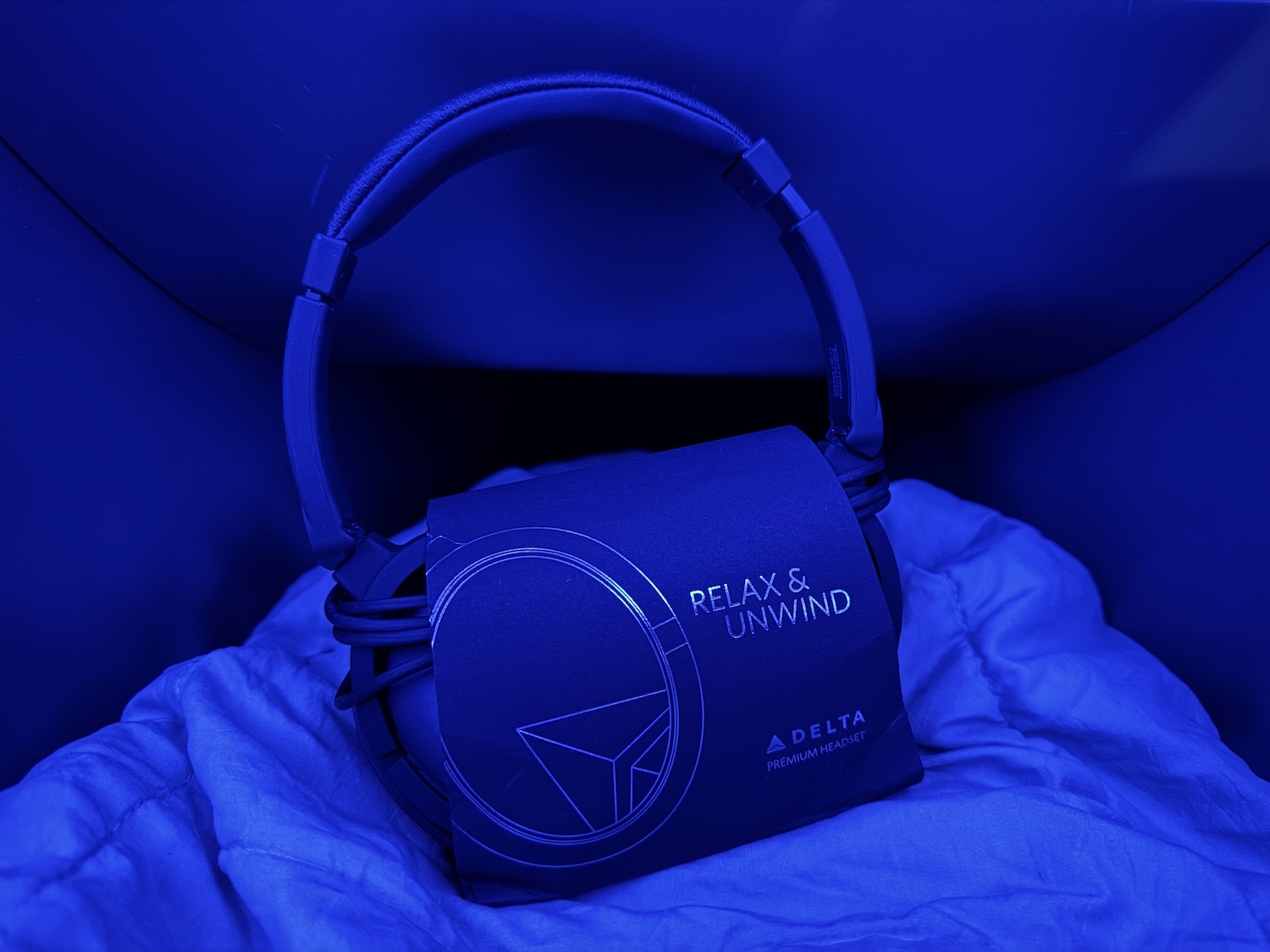 a blue headphones on a blue blanket