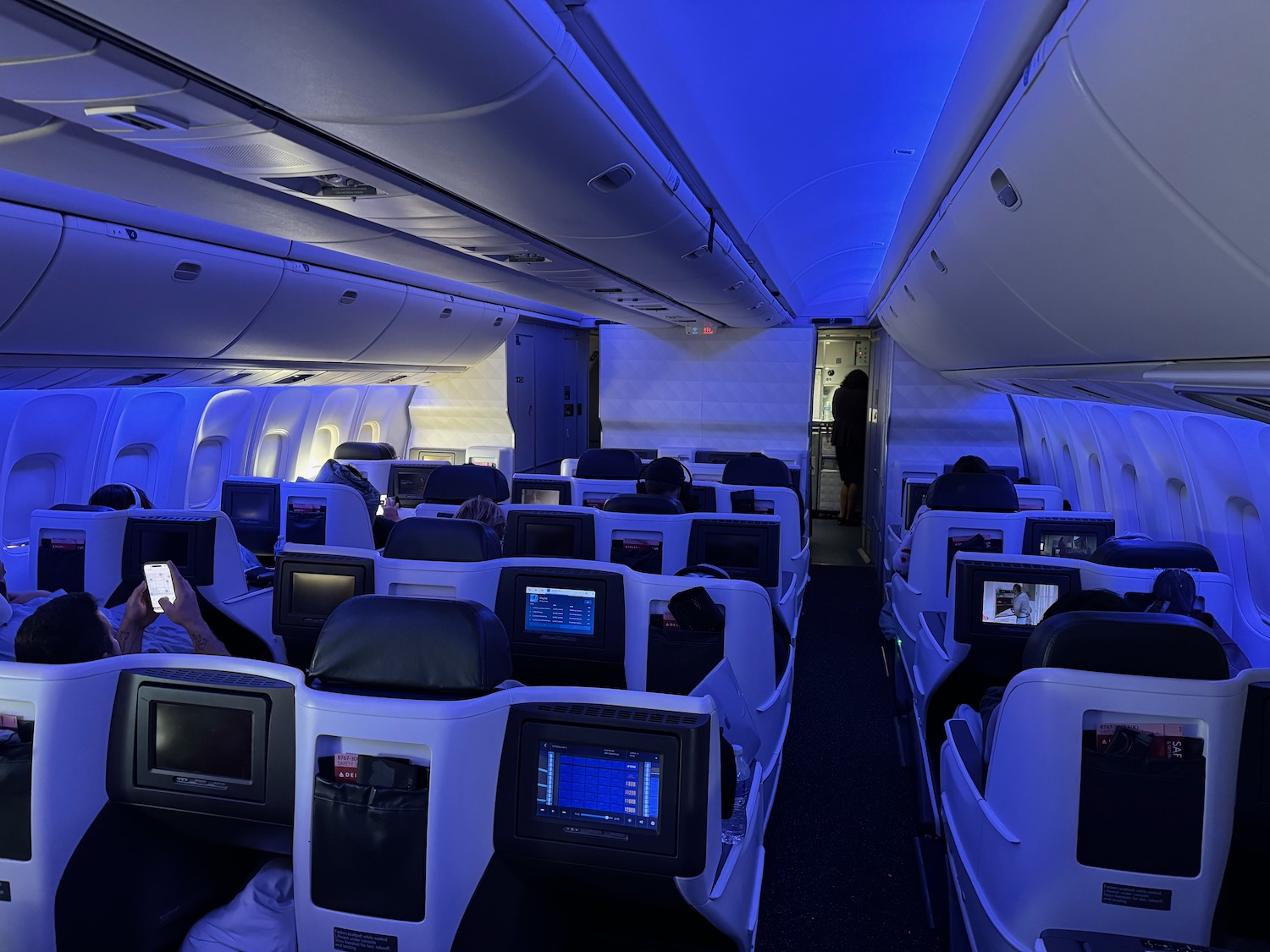 a group of people sitting in an airplane