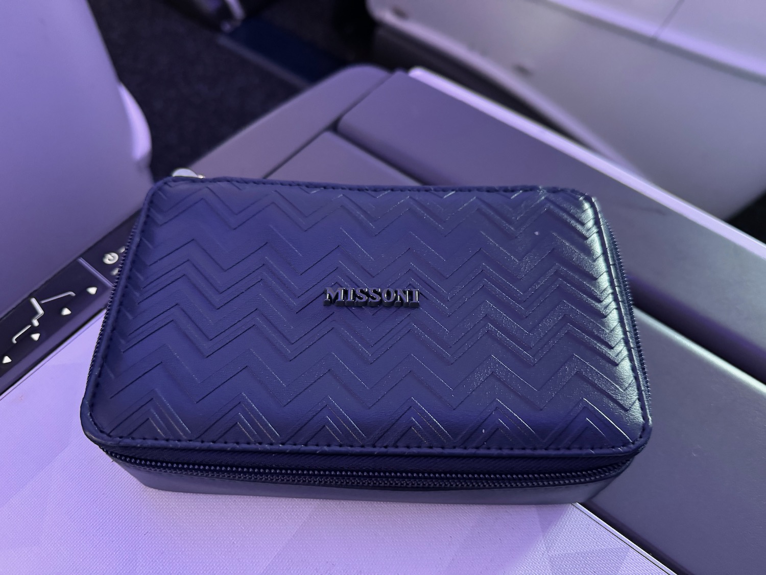 a black leather case on a plane