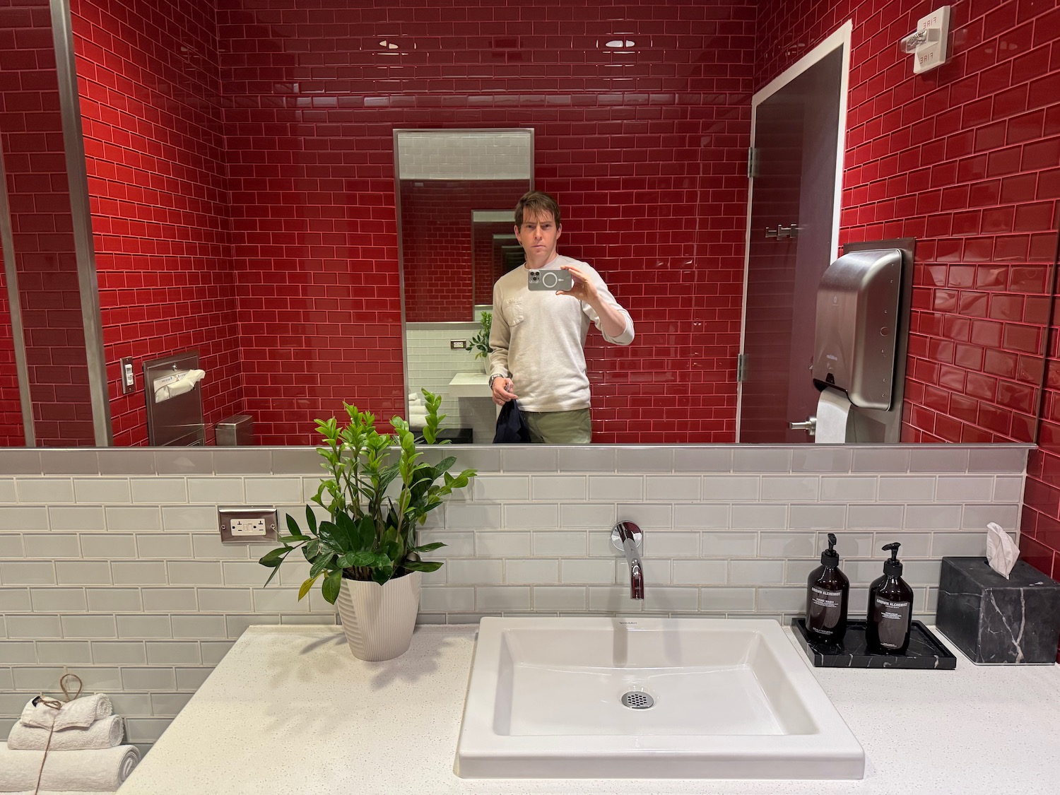 a man taking a selfie in a bathroom