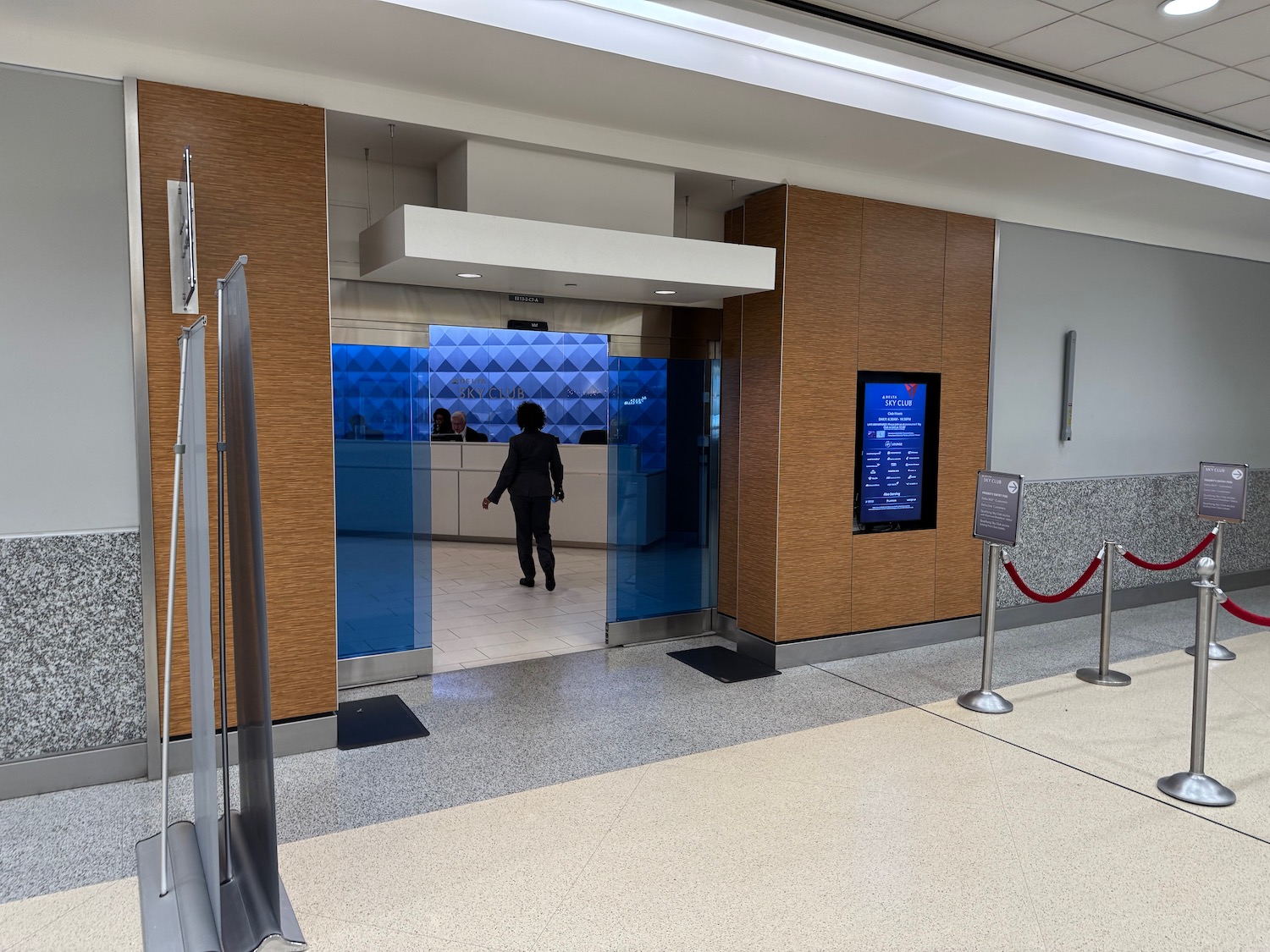 a person walking through a glass door