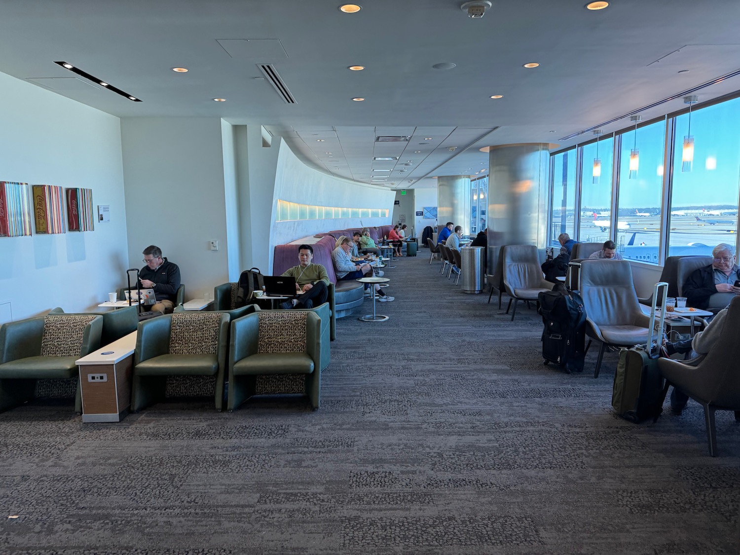 a group of people sitting in a lounge area