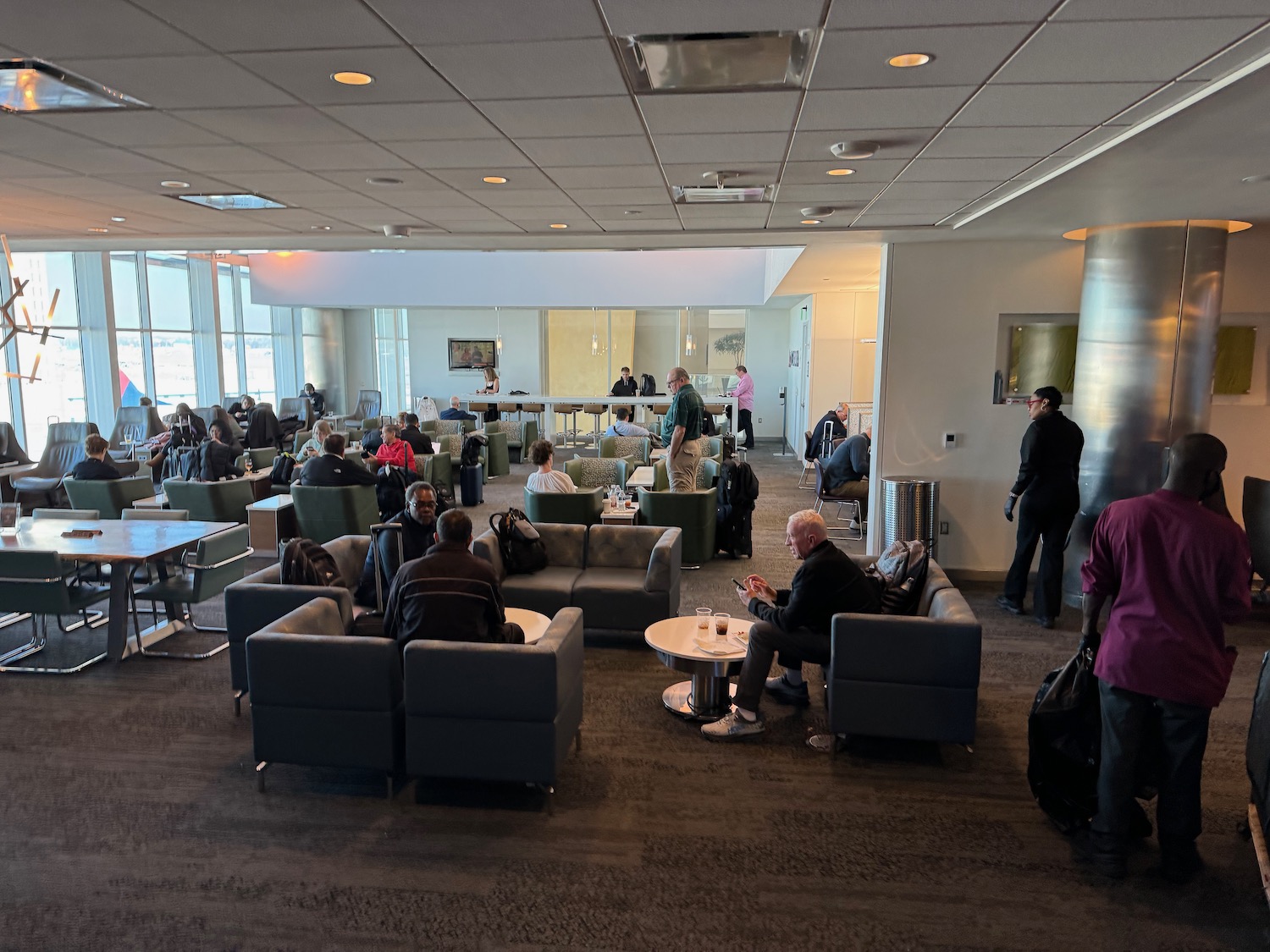 a group of people sitting in a lounge area