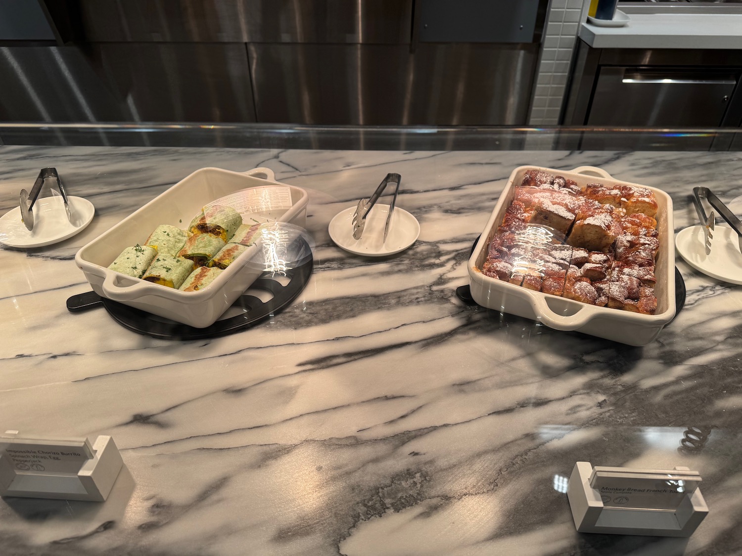 a trays of food on a counter