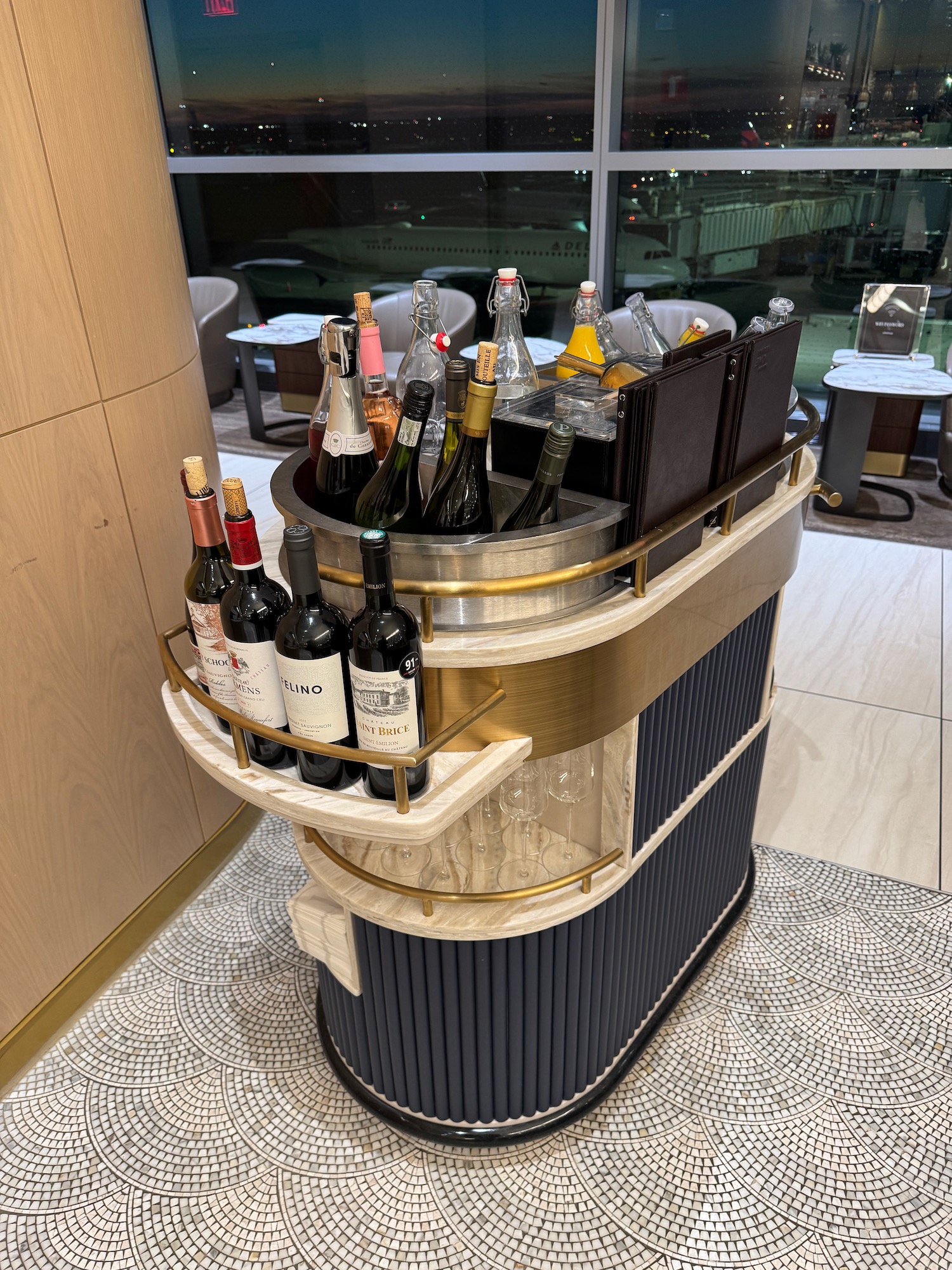 a cart with bottles of wine on it