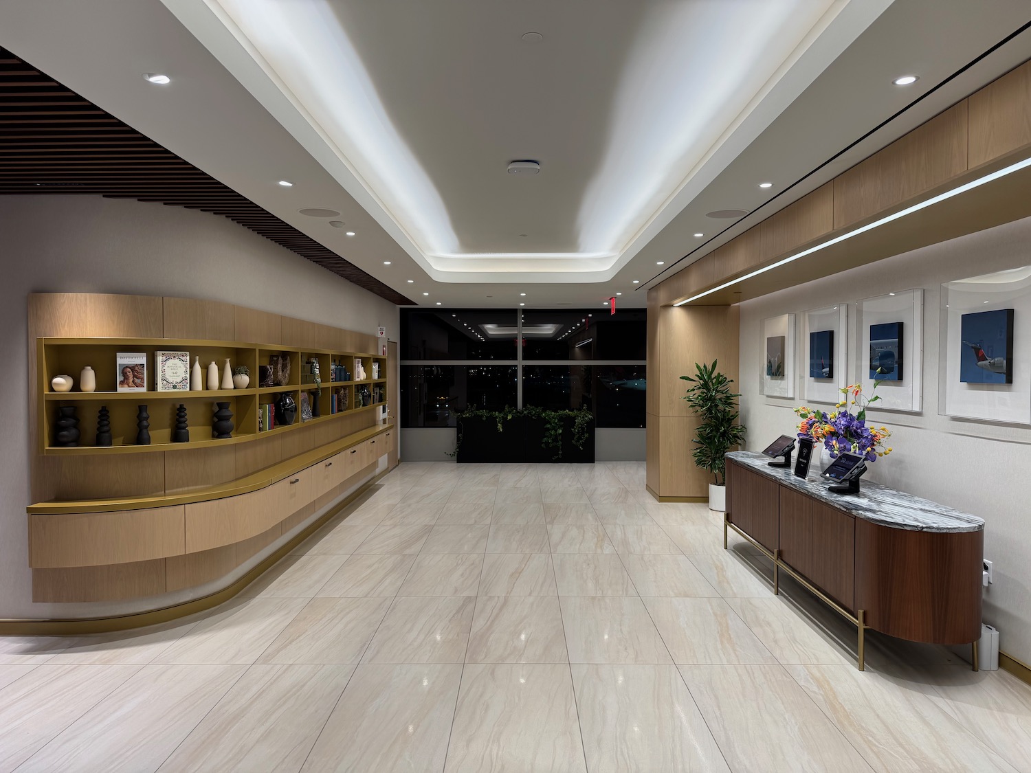 a lobby with a marble floor and a marble counter