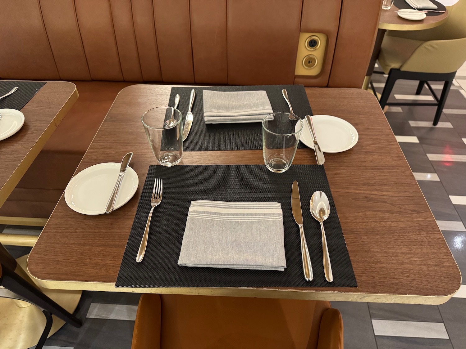 a table with plates and silverware on it