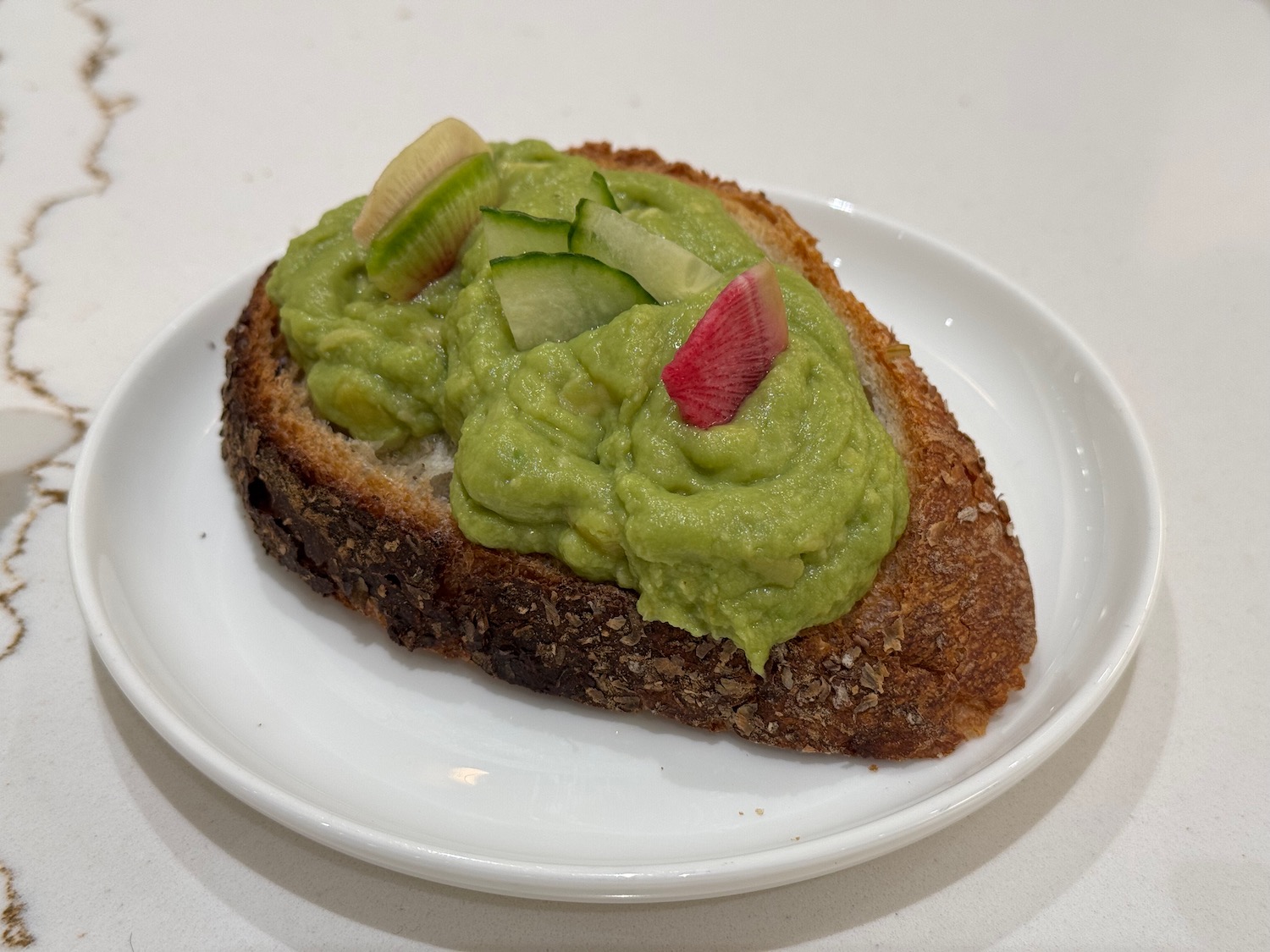 a plate of food on a white surface