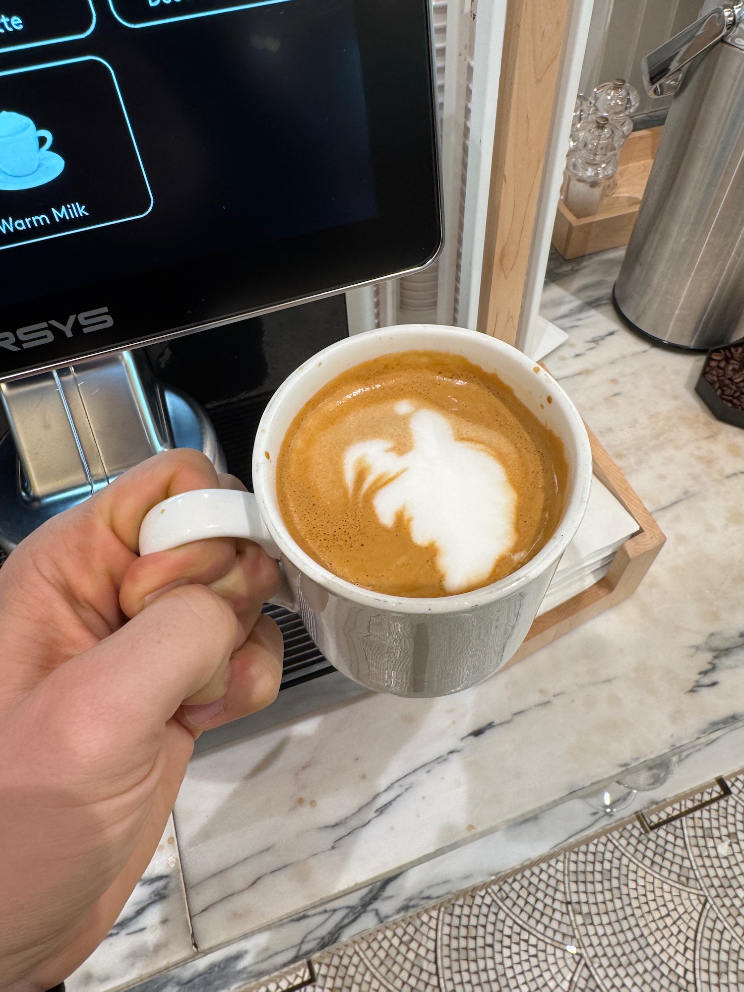 a person holding a cup of coffee