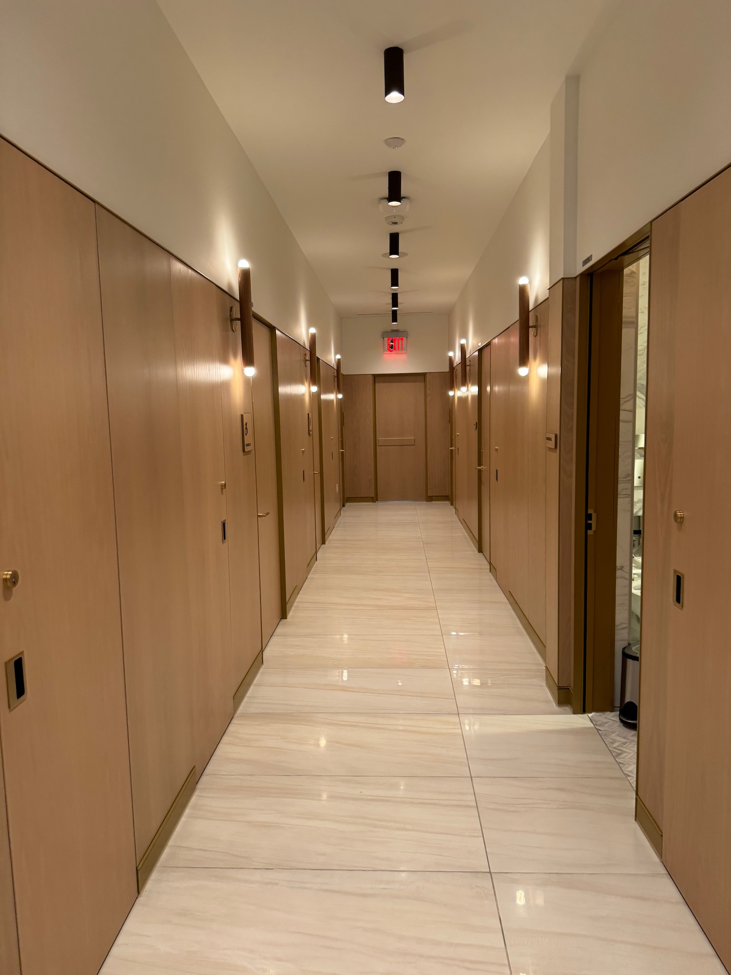 a hallway with doors and lights