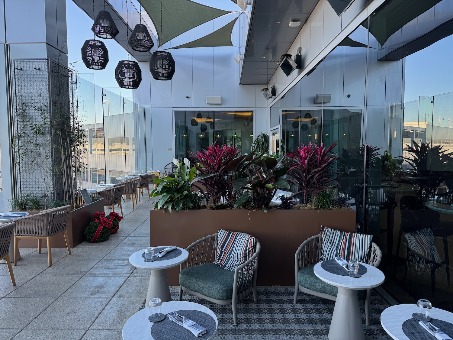 a patio with chairs and tables