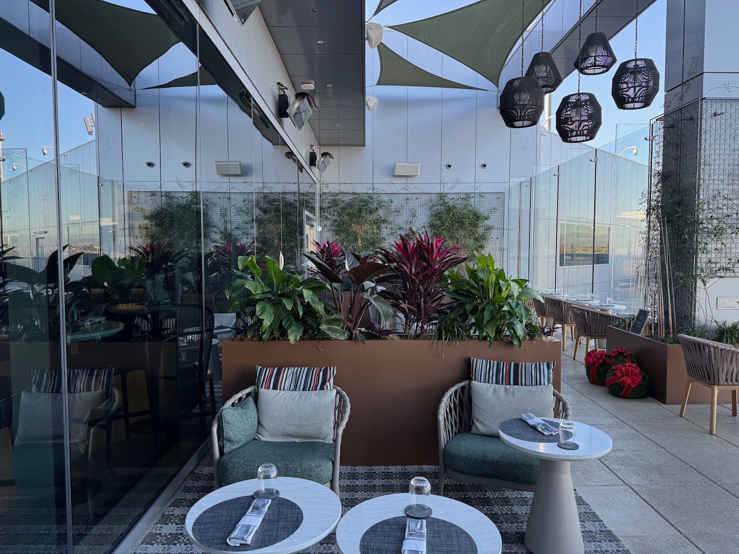 a patio with tables and chairs