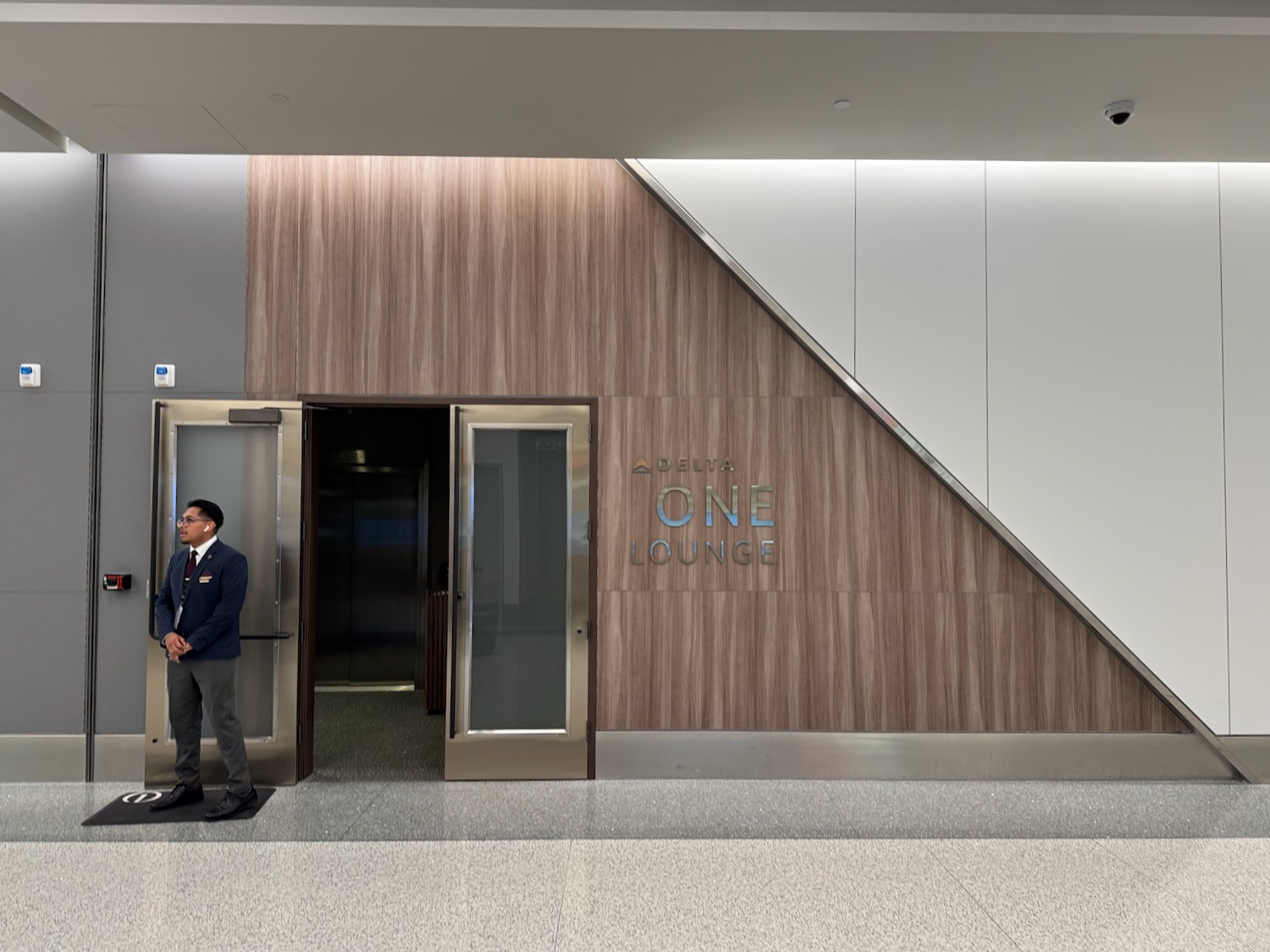 a man standing in front of an elevator