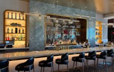 a bar with a counter and chairs