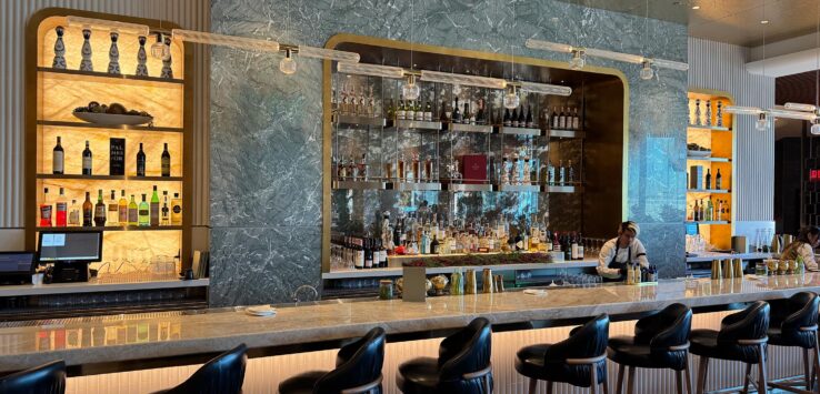 a bar with a counter and chairs