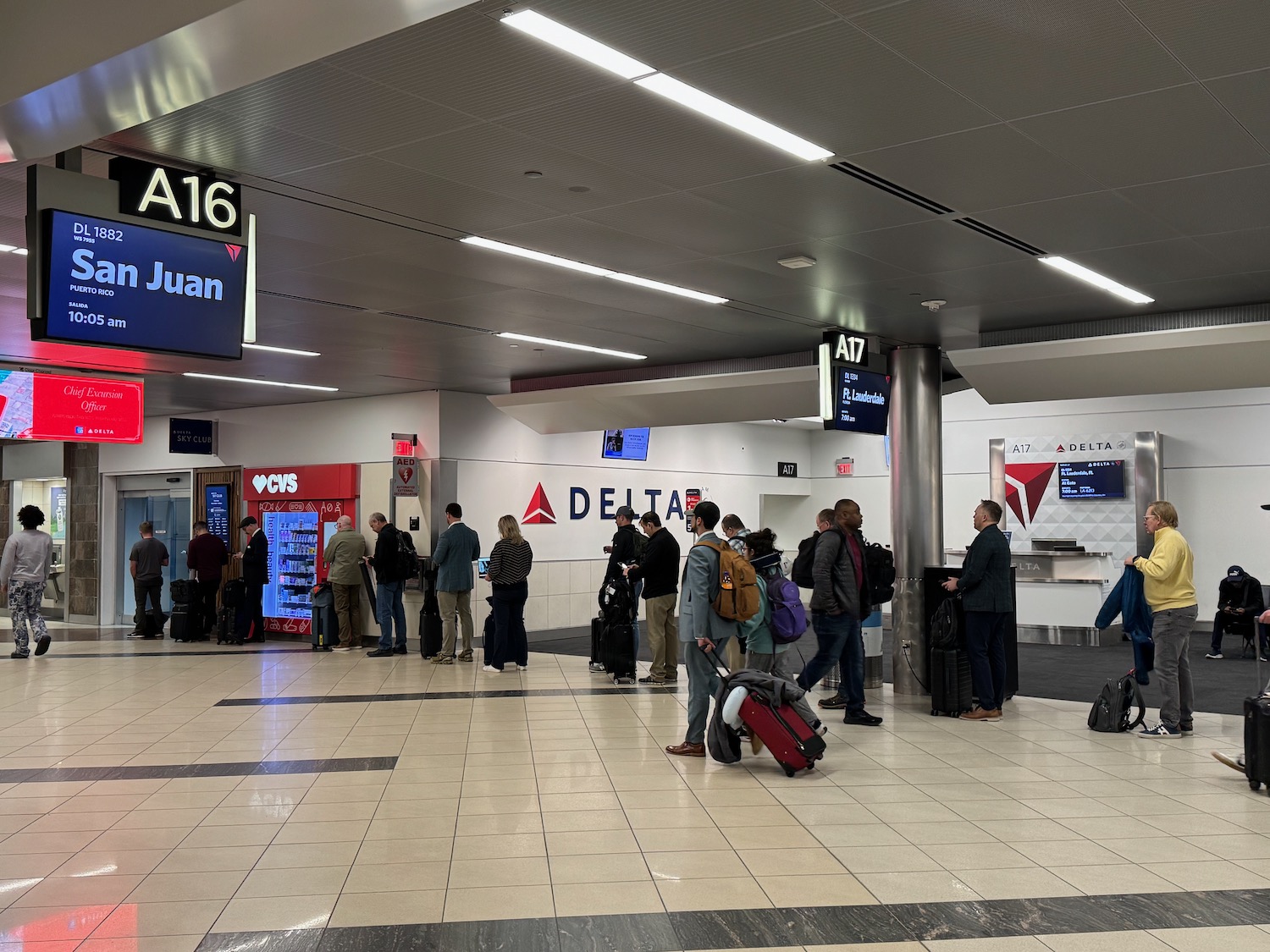 a group of people standing in a terminal