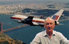 a man taking a selfie with a plane flying over the water