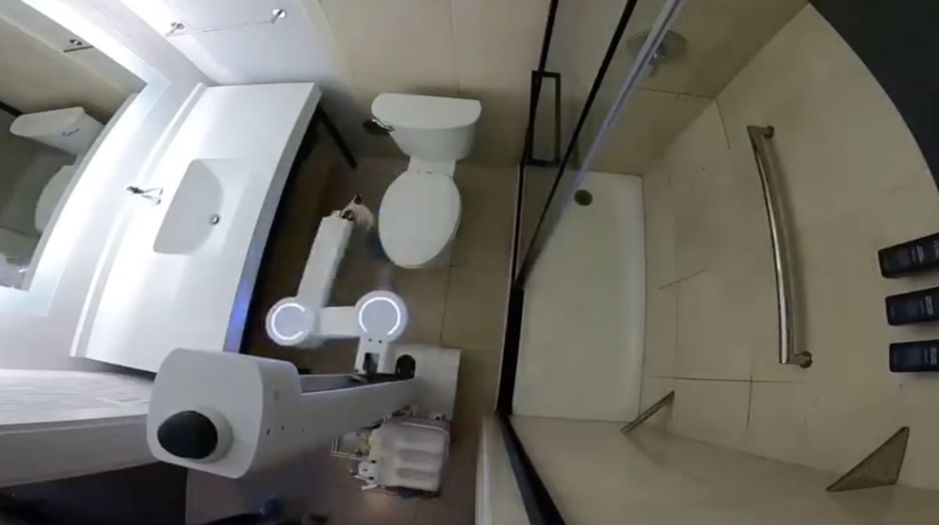 a bathroom with a shower and toilet