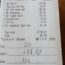 a receipt with black writing on it