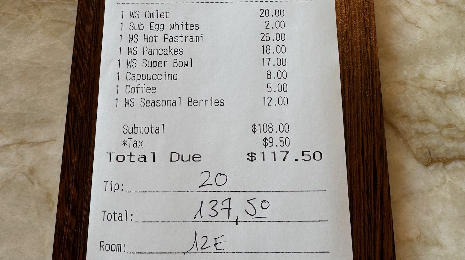 a receipt with black writing on it