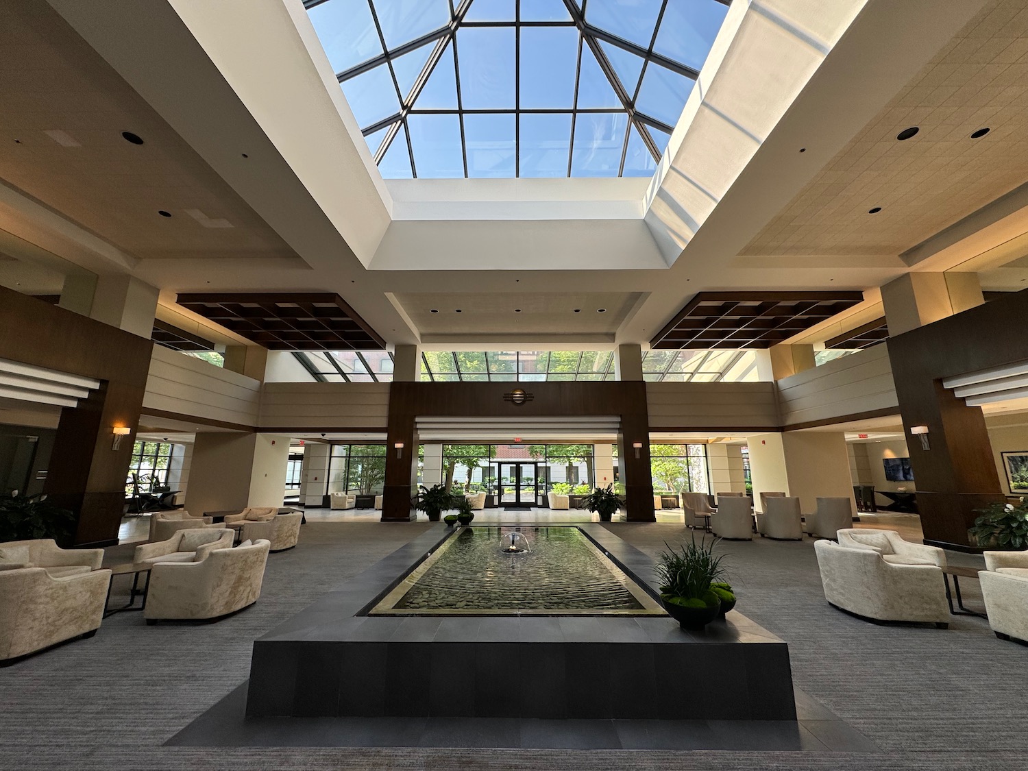 a large indoor pool with a glass roof