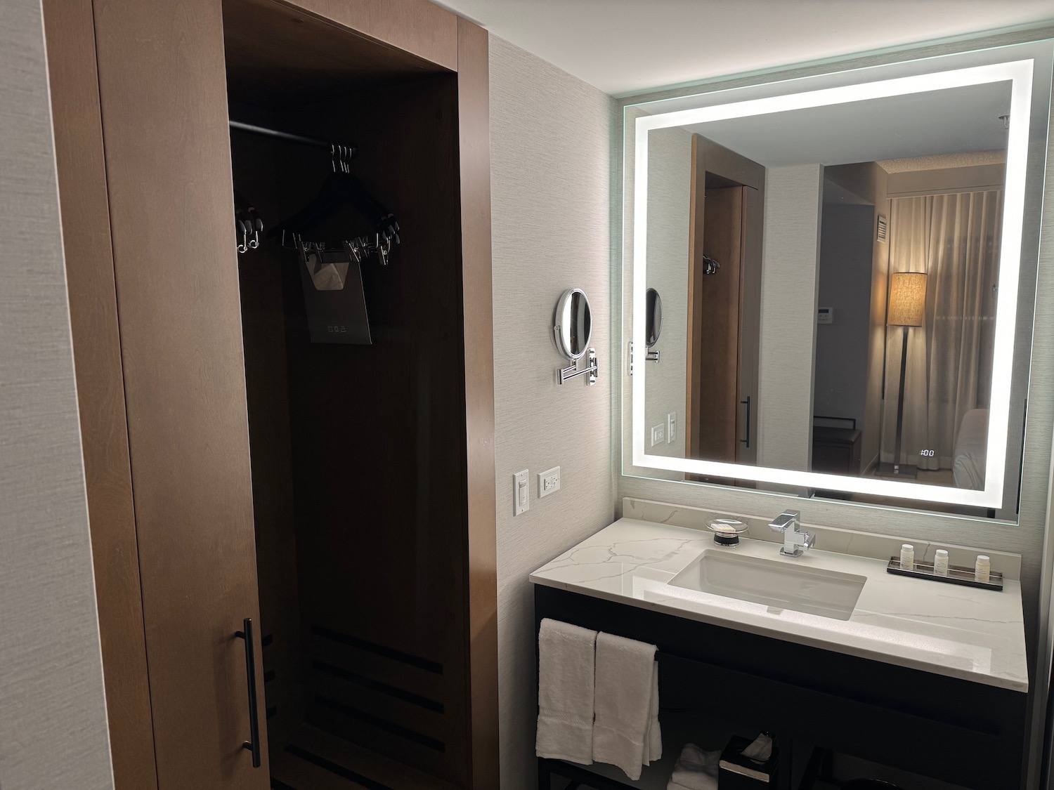 a bathroom with a mirror and a sink