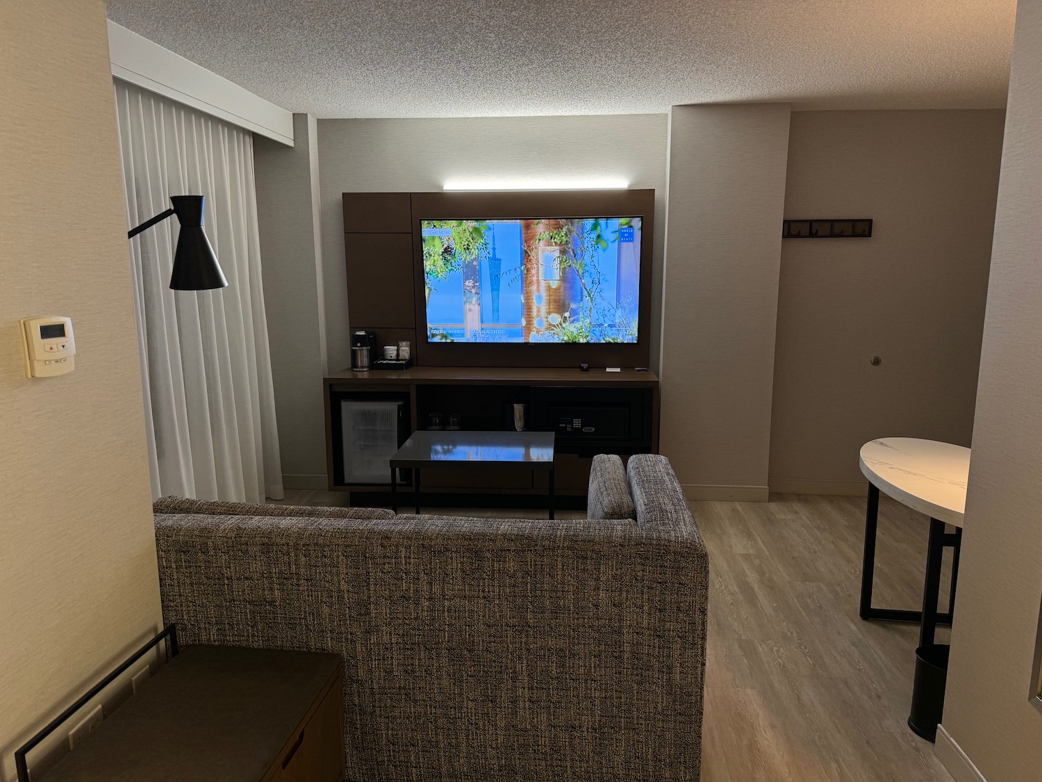 a living room with a television and a table