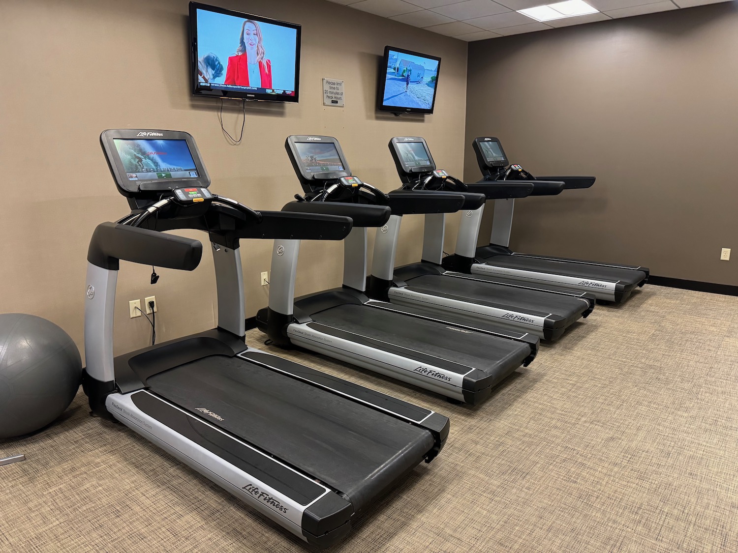 a row of treadmills in a room