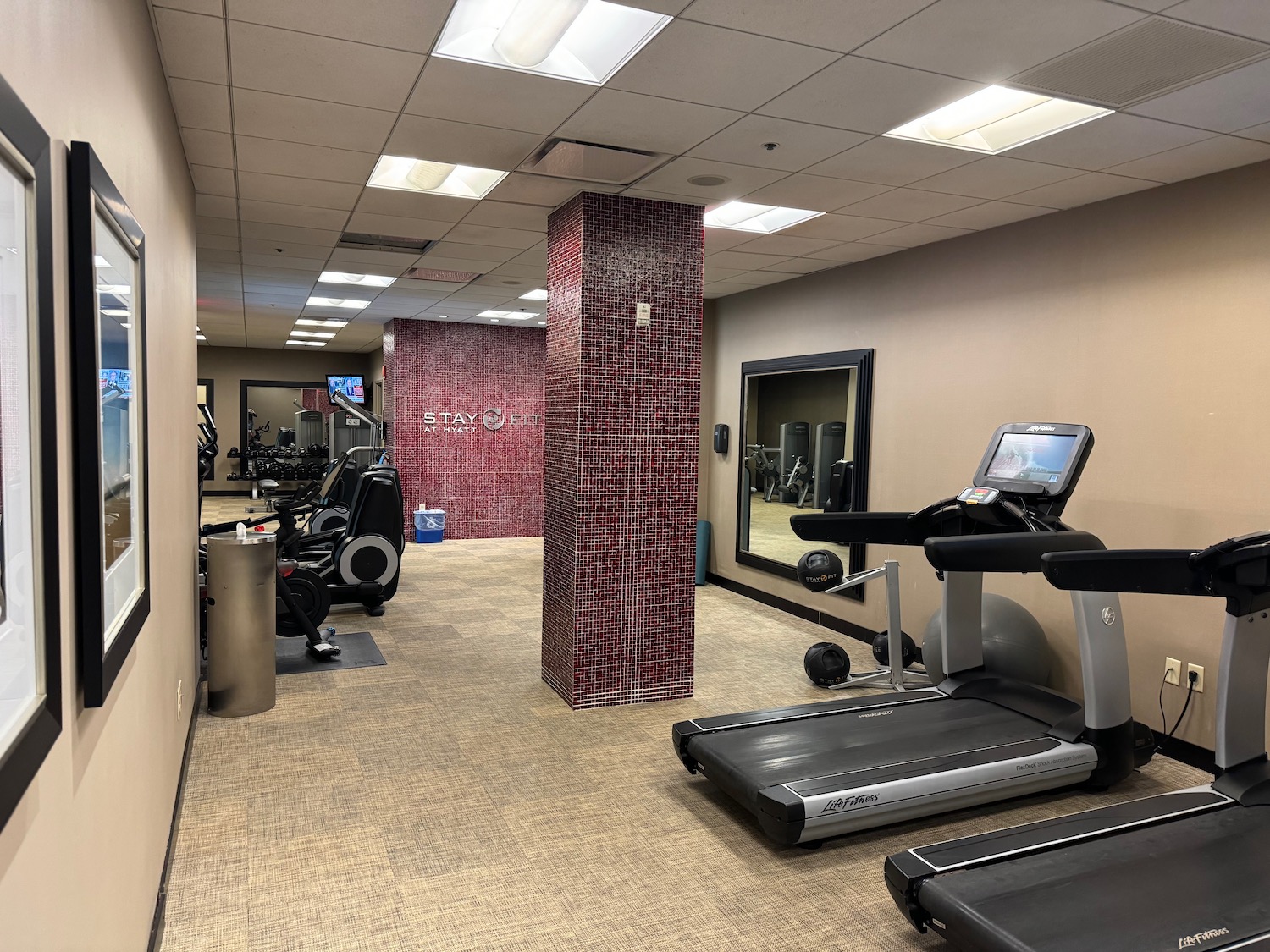 a room with treadmills and exercise equipment