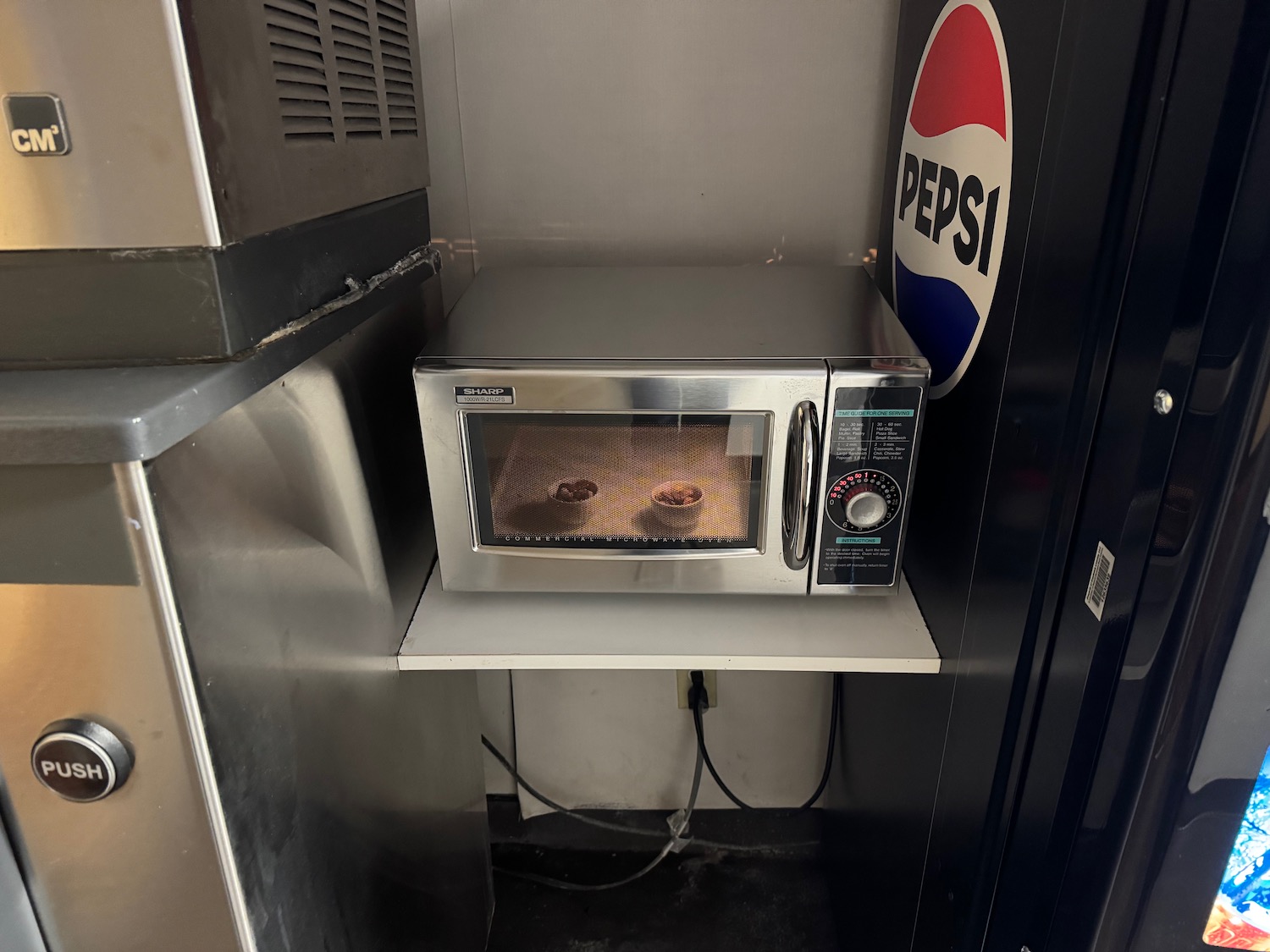 a microwave oven on a shelf