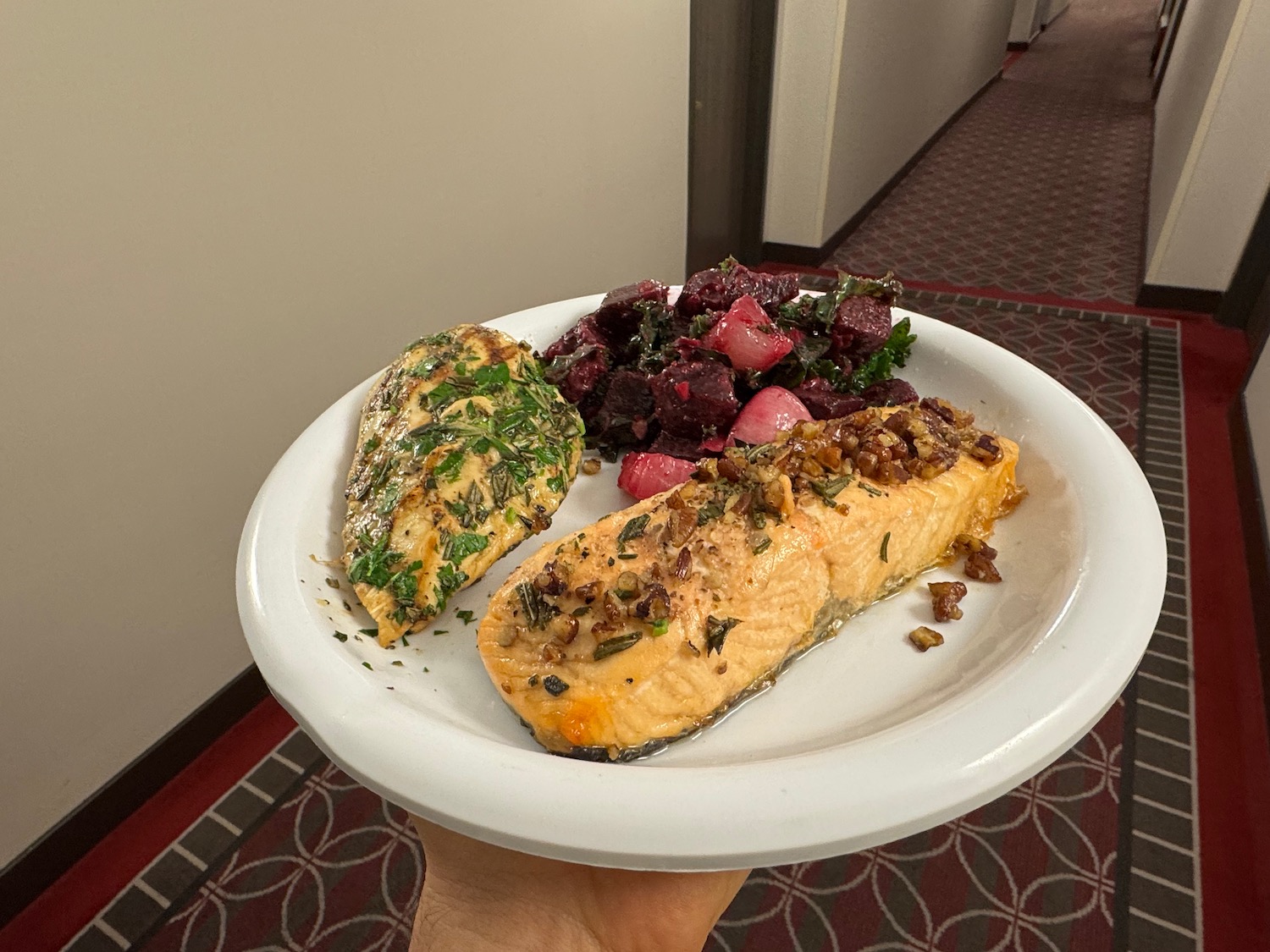 a plate of food on a carpeted surface