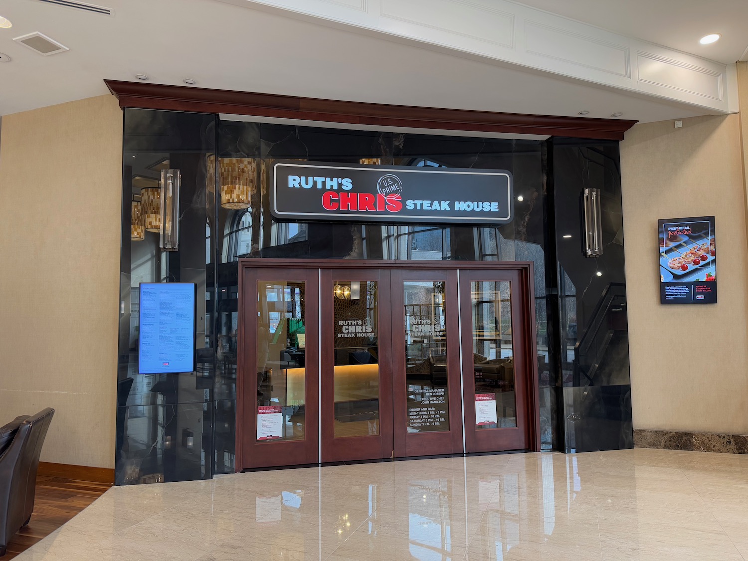 a restaurant entrance with glass doors