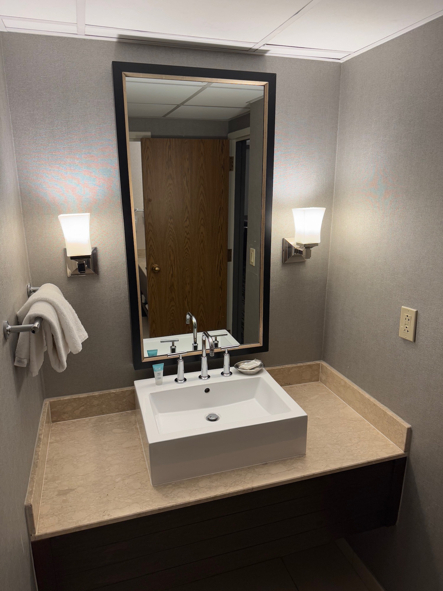 a bathroom with a mirror and sink