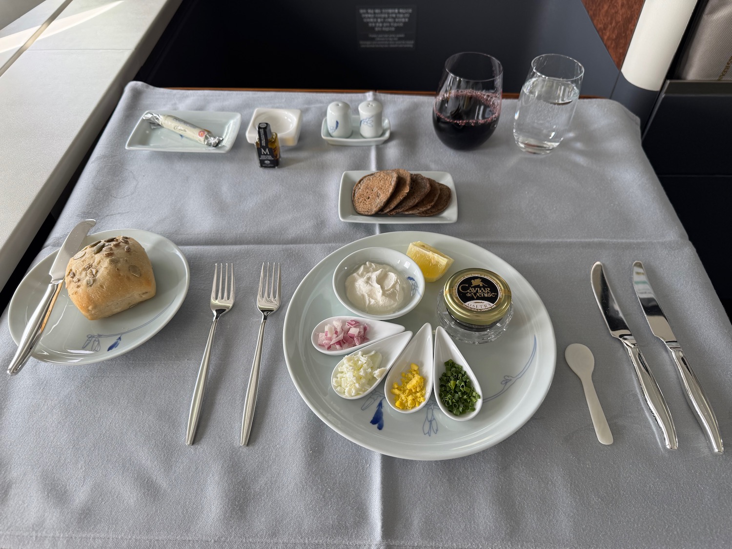 a table with plates of food and utensils