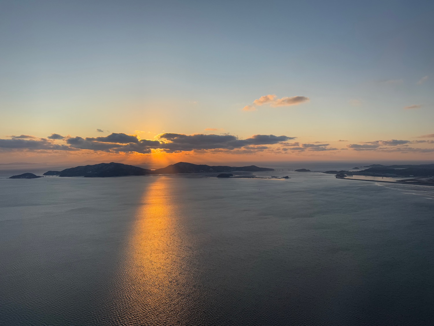 a sunset over a body of water